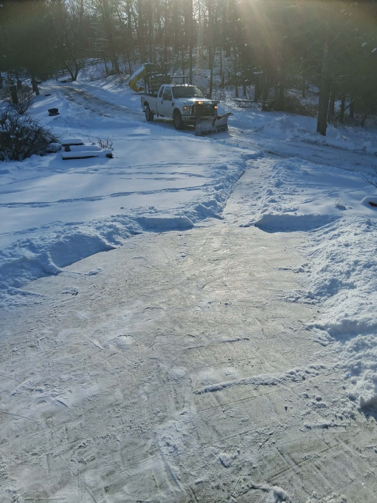 Rifenburgh snow removal - plow truck with salt spreader in action